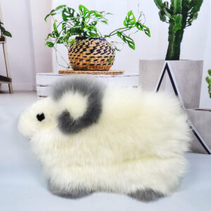 A lamb-shaped sheepskin cushion