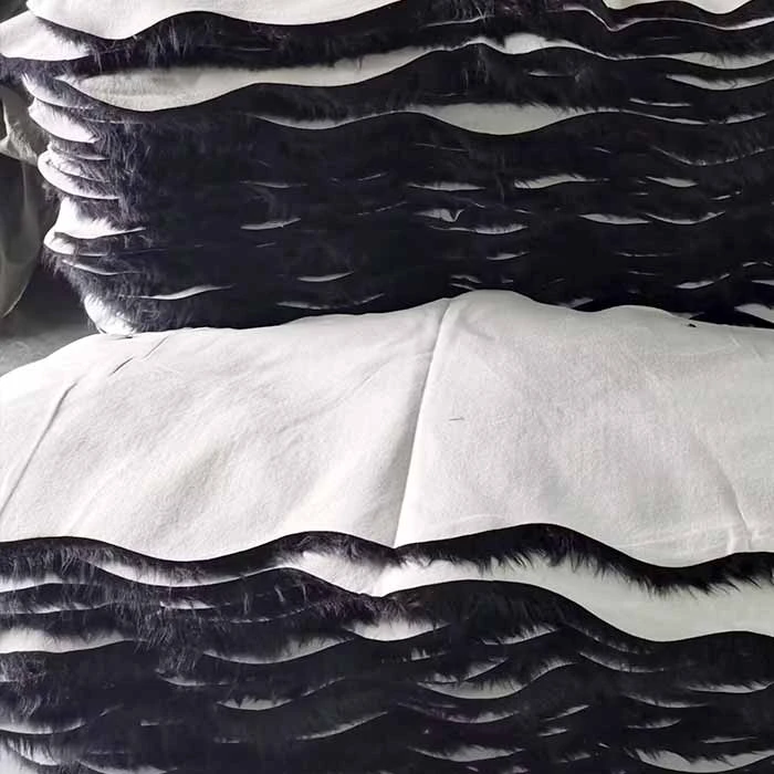 Sheepskin rugs that have already been produced are stacked on top of each other