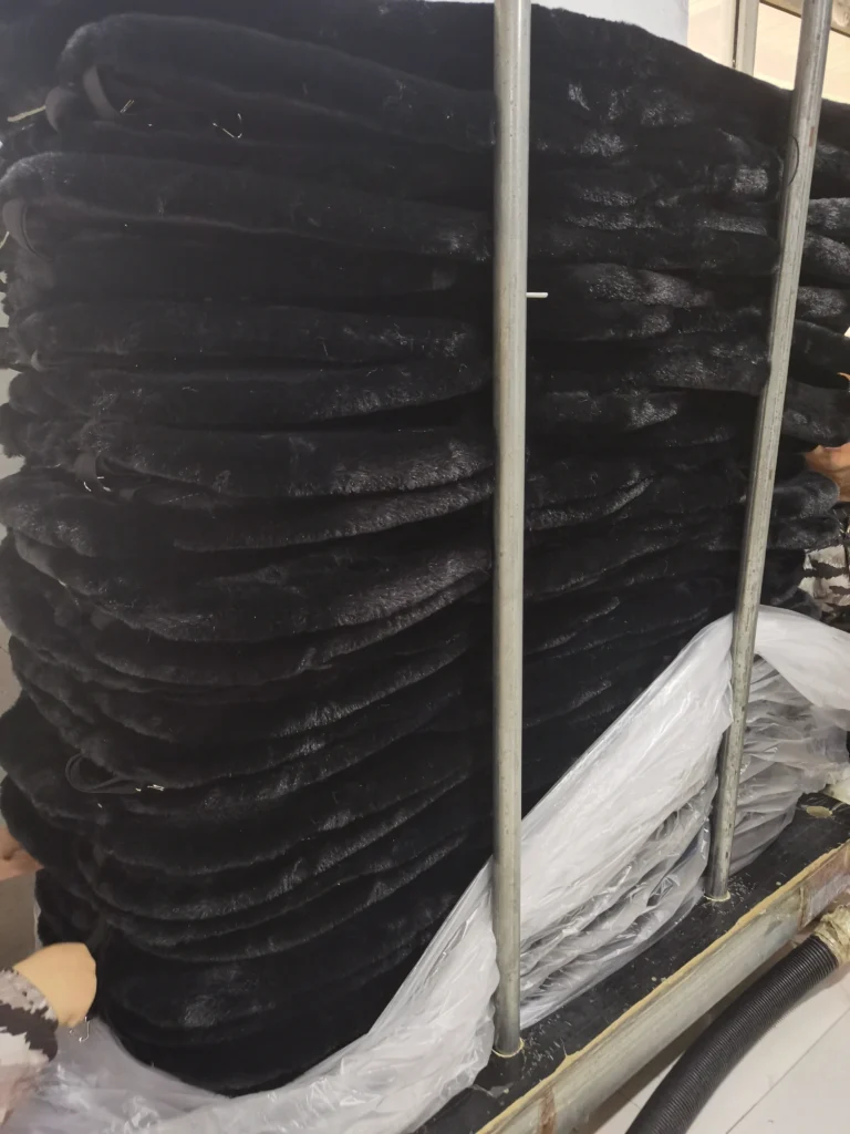 Black faux fur car seat covers being packed