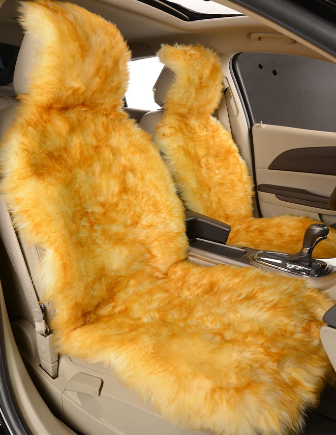 beige color with golden tip sheepskin car seat covers on the passenger side of the car